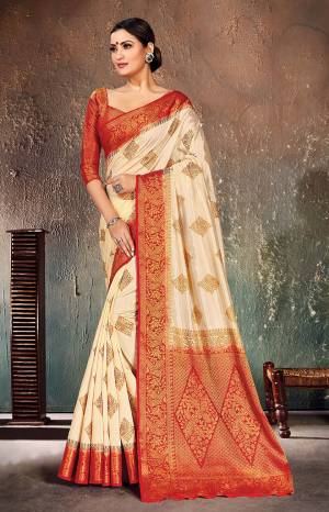 Adorn A Proper Traditional Look Wearing This Designer Silk Based?Saree In Cream Color Paired With Red Colored Blouse. This Saree And Blouse Are Fabricated On Nylon Silk Beautified With Weave