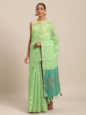Flaunt Your Rich And Elegant Looking Saree In Light Green Color Paired With Sky Blue Colored Blouse. This Saree And Blouse Are Fabricated On Linen Cotton Which Gives A Rich Look To Your Personality.  