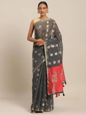 Flaunt Your Rich And Elegant Looking Saree In Dark Grey Color Paired With Dark Pink Colored Blouse. This Saree And Blouse Are Fabricated On Linen Cotton Which Gives A Rich Look To Your Personality.  