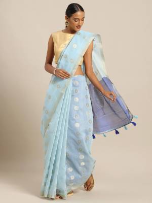 Flaunt Your Rich And Elegant Looking Saree In Baby Blue Color Paired With Blue Colored Blouse. This Saree And Blouse Are Fabricated On Linen Cotton Which Gives A Rich Look To Your Personality.  