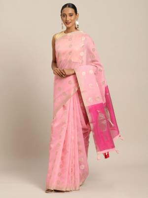 You Will Definitely Earn Lots Of Compliments Wearing This Pretty Elegant Looking Saree In Baby Pink Color Paired With Dark Pink Colored Blouse. This Saree and Blouse Are Fabricated On Linen Cotton. It Is Light Weight, Durable And Easy To Care For. 