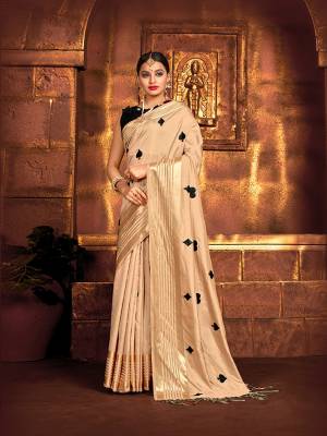 Flaunt Your Rich And Elegant Taste In This Pretty Beige Colored Saree Paired With Black Colored Blouse. This Saree and Blouse Are Fabricated On Art Silk, Its Fabric And Color Gives A Rich Look To Your Personality. 