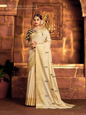 Flaunt Your Rich And Elegant Taste In This Pretty Cream Colored Saree Paired With Black Colored Blouse. This Saree and Blouse Are Fabricated On Art Silk, Its Fabric And Color Gives A Rich Look To Your Personality. 