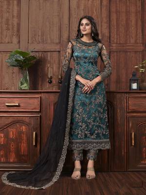 Get Ready For The Upcoming Festive And Wedding Season With This Designer Straight Suit In Teal Blue Color Fabricated On Net. It Is Beautified With Heavy Embroidery Over Top, Bottom and Dupatta. 