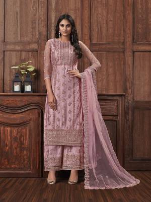 Here Is A Beautiful Heavy Embroidered Designer Suit In Baby Pink Color Which Also Comes With A Heavy Embroidered Jacket, This Pretty Suit Is Net Based With Satin Inner. Buy This Semi-Stitched Suit Now.