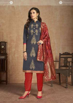 Grab This Pretty Cotton Based Dress Material In Dark Grey Colored Top Paired With Red Colored Bottom and Dupatta. This Straight Suit Can Be Customised As Per Your Desired Fit and Comfort. 