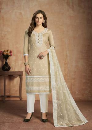 For your Semi-Casual Wear, Here Is A Pretty Straight Suit In Cream And White Color. This Pretty Suit Is Cotton Based Beautified With Thread Work. Buy This Dress Material Now.
