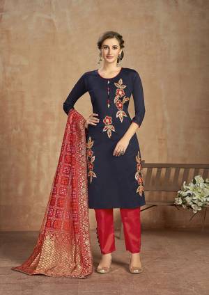 For your Semi-Casual Wear, Here Is A Pretty Straight Suit In Navy And Red Color. This Pretty Suit Is Cotton Based Beautified With Thread Work. Buy This Dress Material Now.