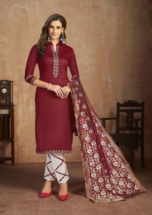 Grab This Pretty Cotton Based Dress Material In Maroon Colored Top Paired With White Colored Bottom and Maroon Dupatta. This Straight Suit Can Be Customised As Per Your Desired Fit and Comfort. 