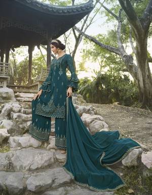 Attract All Wearing This Designer Suit In Teal Blue Color. Its Pretty Top Is Fabricated On Chinon Paired With Georgette Fabricated Bottom and Dupatta. This Suit's Top, Bottom And Dupatta Are Beautified With Detailed Heavy Embroidery. Buy This Pretty Piece Now. 