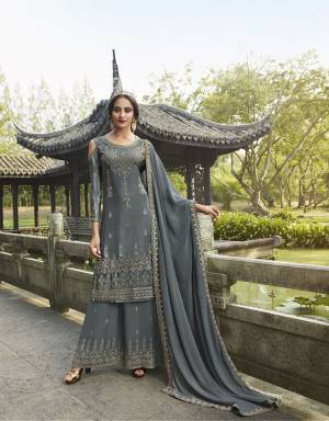 Attract All Wearing This Designer Suit In Dark Grey Color. Its Pretty Top Is Fabricated On Chinon Paired With Georgette Fabricated Bottom and Dupatta. This Suit's Top, Bottom And Dupatta Are Beautified With Detailed Heavy Embroidery. Buy This Pretty Piece Now. 