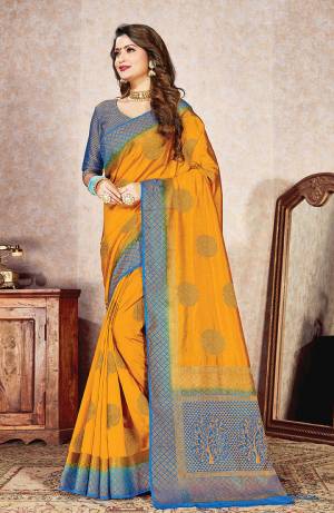 Shine Bright Wearing This Designer Silk Based Saree In Musturd Yellow Color Paired With Contrasting Blue Colored Blouse. This Saree And Blouse Are Fabricated On Nylon Silk Beautified With Weave. 