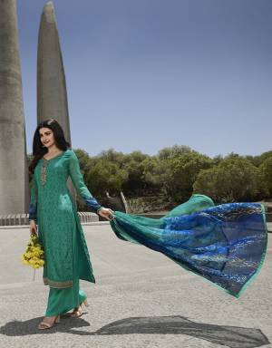 Rich And Elegant Looking Designer Straight Suit Is Here In Sea Green Color. Its Pretty Top Is Crepe Based Paired With Santoon Bottom And Chiffon Dupatta.It Is Beautified With Prints And Attractive Embroidery. 