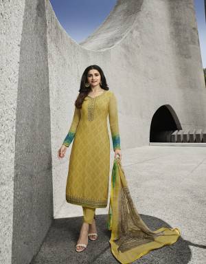 Add This Very Pretty Suit To Your Wardrobe In Yellow Color. This Designer Straight Suit Is Crepe Based Paired With Santoon Bottom and Chiffon Dupatta. Its Fabrics Are Soft Towards Skin, Light Weight And Easy To Carry Through out The Gala. 