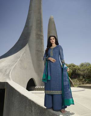 Add This Very Pretty Suit To Your Wardrobe In Blue Color. This Designer Straight Suit Is Crepe Based Paired With Santoon Bottom and Chiffon Dupatta. Its Fabrics Are Soft Towards Skin, Light Weight And Easy To Carry Through out The Gala. 