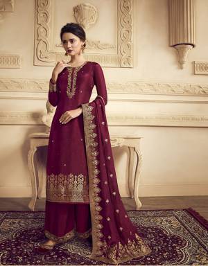 You Will Definitely Earn Lots Of Compliments Wearing This Designer Straight Suit With Heavy Dupatta Concept. This Lovely Maroon Colored Suit Is Silk Based Beautified with Weaving And Hand Work. Its Rich Color And Fabric Gives An Attractive Look To Your Pers