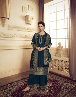 You Will Definitely Earn Lots Of Compliments Wearing This Designer Straight Suit With Heavy Dupatta Concept. This Lovely Prussian Blue Colored Suit Is Silk Based Beautified with Weaving And Hand Work. Its Rich Color And Fabric Gives An Attractive Look To Your Pers