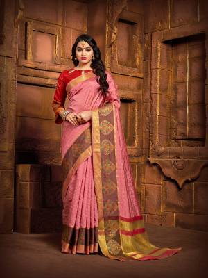Flaunt Your Rich And Elegant Taste Wearing This Rich Fabricated Silk Based saree In Pink Color Paired With Red Colored Blouse. It Is Beautified With Weave Which Also A Proper Traditional Touch To Your Look. 