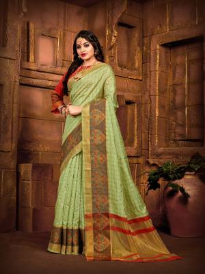 Flaunt Your Rich And Elegant Taste Wearing This Rich Fabricated Silk Based saree In Light Green Color Paired With Red Colored Blouse. It Is Beautified With Weave Which Also A Proper Traditional Touch To Your Look. 