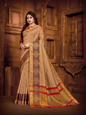 Flaunt Your Rich And Elegant Taste Wearing This Rich Fabricated Silk Based saree In Beige Color Paired With Red Colored Blouse. It Is Beautified With Weave Which Also A Proper Traditional Touch To Your Look. 