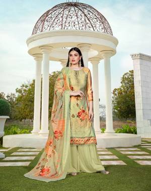 Here Is A Very Pretty Designer Straight Suit In Light Green Color. Its Top Is Fabricate On Cotton Silk Paired With Cotton Bottom And Soft Cotton Dupatta. This Pretty Suit Is Beautified With Digital Print And Tone To Tone Thread Work. It Is Light In Weight And Easy To Carry All Day Long. 