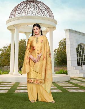 Flaunt Your Rich And Elegant Taste In This Lovely Designer Straight suit In Light Yellow color. Its Top Is Cotton Silk Based Paired With Cotton Bottom And Soft Cotton Dupatta. It Has Elegant Tone To Tone Thread Work With Digital Print.