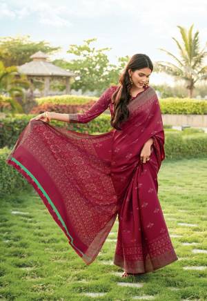 Her Is A Very Pretty Light Weight Designer Printed Saree In Maroon Color. This Saree And Blouse Are Fabricated On Kora Satin Which Is Soft Towards Skin And Easy To Carry All Day Long. 