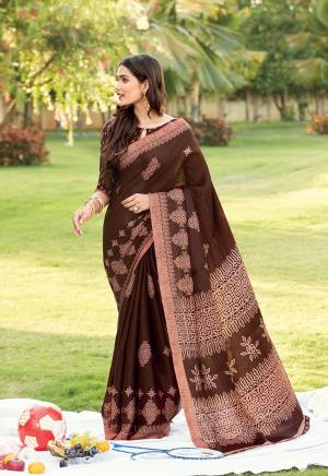 For your Semi-Casual Wear, Grab This Saree In Brown Color. This Saree And Blouse Are Fabricated On Kora Satin Beautified With Prints. Buy This Pretty Saree Now.