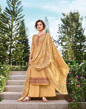 You Will Definitely Earn Lots Of Compliments Wearing This Designer Straight Suit In Occur Yellow Color. Its Top Is Tussar Silk Based Beautified With Heavy Embroidery Paired With Santoon Bottom And Jacquard Silk Fabricated Dupatta. 