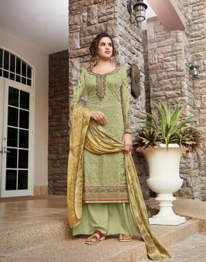 Flaunt Your Rich And Elegant Taste Wearing This Heavy Designer Straight Suit In Pastel Green Color. Its Heavy Embroidered Top IS Fabricated On Tussar Art Silk Paired With Santoon Bottom and Jacquard Silk Fabricated Dupatta. 