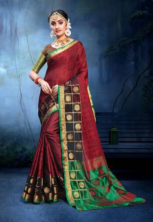 Add This Pretty Designer Saree In Maroon Colored Paired With Green Colored Blouse. This Saree Is Fabricated On Cotton Silk Paired With Art Silk Fabricated Blouse. It Is Beautified With Weave All Over. 