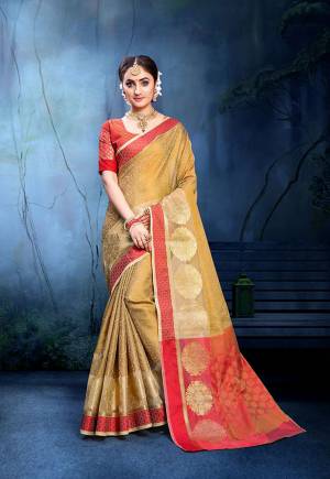 For A Proper Traditional Look, Grab This Pretty Saree In Beige Color Paired With Red Colored Blouse. This Saree Is Fabricated On Cotton Silk Paired With Art Silk Fabricated Blouse. Buy This Saree Now.
