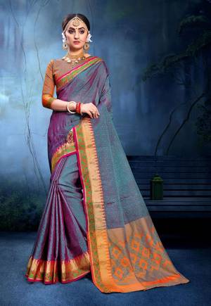 For A Proper Traditional Look, Grab This Pretty Saree In Puplr & Blue Color Paired With Orange Colored Blouse. This Saree Is Fabricated On Cotton Silk Paired With Art Silk Fabricated Blouse. Buy This Saree Now.