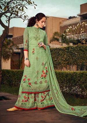Celebrate This Festive And Wedding Season With This Pretty Straight Suit In Light Green Color. Its Top, Bottom And Dupatta Are Georgette Based Beautified With Prints And Stone Work. 
