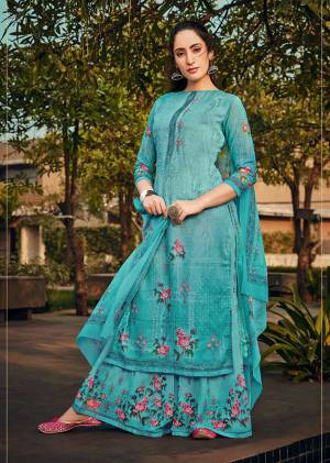 Celebrate This Festive And Wedding Season With This Pretty Straight Suit In Sky Blue Color. Its Top, Bottom And Dupatta Are Georgette Based Beautified With Prints And Stone Work. 