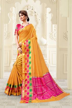 Celebrate This  Festive Season With Beauty And Comfort Wearing This Designer Saree In Musturd Yellow color Paired With Contrasting Dark Pink Colored Blouse. This Saree Is Fabricated On Cotton Silk Paired With Art Silk Fabricated Blouse. 