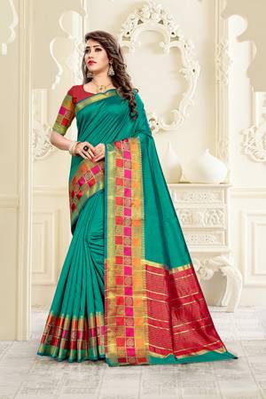 Celebrate This  Festive Season With Beauty And Comfort Wearing This Designer Saree In Teal Green color Paired With Contrasting Maroon Colored Blouse. This Saree Is Fabricated On Cotton Silk Paired With Art Silk Fabricated Blouse. 
