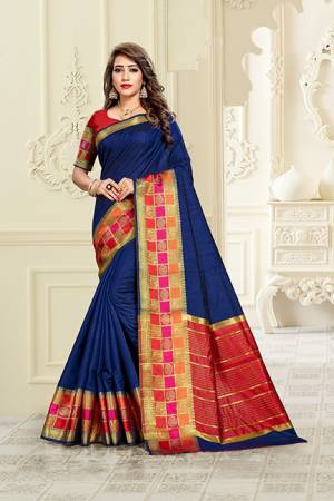 Adorn A Proper Traditional Look Wearing This Rich Silk Based Saree In Royal Blue Color Paired With Red Colored Blouse. This Saree Is Fabricated On Cotton Silk Paired With Art Silk Fabricated Blouse. Buy Now.