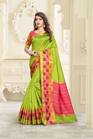Adorn A Proper Traditional Look Wearing This Rich Silk Based Saree In Parrot Green Color Paired With Pink Colored Blouse. This Saree Is Fabricated On Cotton Silk Paired With Art Silk Fabricated Blouse. Buy Now.