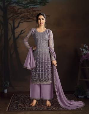 Look Pretty In This Very Beautiful Heavy Designer Straight Suit In Purple Color. Its Top Is Fabricated On Net Paired With Silk Based bottom And Chiffon Dupatta. This Pretty Suit IS Suitable For Festive, Wedding Occasion Wear. Buy Now.