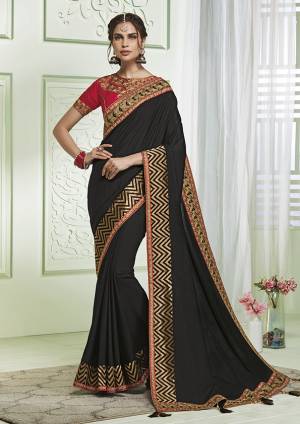 For A Bold And Beautiful Look, Grab This Designer Black colored Saree Paired With Red Colored Blouse. This Saree and Blouse Are Fabricated On Art Silk Beautified With Elegant Detailed Embroidery. 