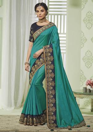 Grab This Pretty Saree For Your Semi-Casuals Or Festive Wear In Blue Color Paired With Navy Blue Colored Blouse.This  Saree And Blouse Are Silk Based Which Gives A Rich look To Your Personality. 