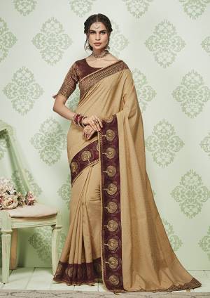 For A Bold And Beautiful Look, Grab This Designer Beige colored Saree Paired With Maroon Colored Blouse. This Saree and Blouse Are Fabricated On Art Silk Beautified With Elegant Detailed Embroidery. 