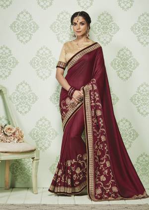Grab This Pretty Saree For Your Semi-Casuals Or Festive Wear In Maroon Color Paired With Contrasting Cream Colored Blouse .This  Saree And Blouse Are Silk Based Which Gives A Rich look To Your Personality. 