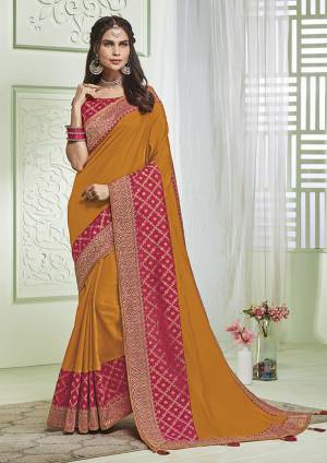 For A Bold And Beautiful Look, Grab This Designer Musturd Yellow colored Saree Paired With Rani Pink Colored Blouse. This Saree and Blouse Are Fabricated On Art Silk Beautified With Elegant Detailed Embroidery. 