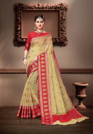 For Your Semi-Casual Wear, Grab This Pretty Saree In Cream Color Paired With Red Colored Blouse. This Saree And Blouse Are Fabricated On Cotton Silk Beautified With Weave. Buy This Saree Now.