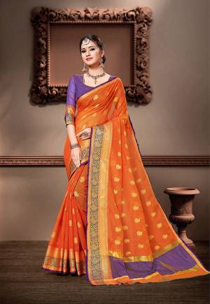 For Your Semi-Casual Wear, Grab This Pretty Saree In Orange Color Paired With Violet Colored Blouse. This Saree And Blouse Are Fabricated On Cotton Silk Beautified With Weave. Buy This Saree Now.