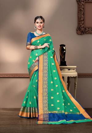 For Your Semi-Casual Wear, Grab This Pretty Saree In Sea Green Color Paired With Royal Blue Colored Blouse. This Saree And Blouse Are Fabricated On Cotton Silk Beautified With Weave. Buy This Saree Now.