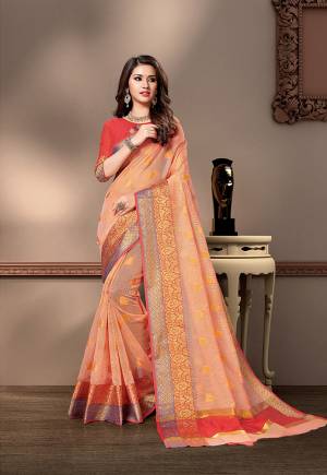 Pretty Simple And Elegant Looking Saree Is Here In Peach Color Paired With Orange Colored Blouse. This Saree And Blouse Are Fabricated On Cotton Silk Beautified With Weave. 