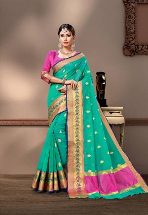 For Your Semi-Casual Wear, Grab This Pretty Saree In Sea Green Color Paired With Rani Pink Colored Blouse. This Saree And Blouse Are Fabricated On Cotton Silk Beautified With Weave. Buy This Saree Now.